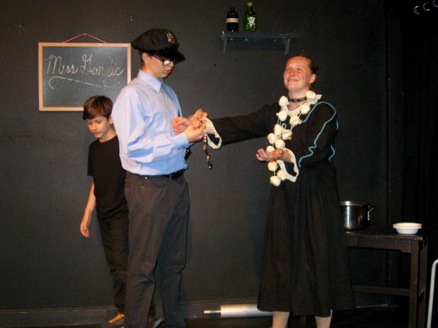 An actor getting arrested by another actor playing a police officer