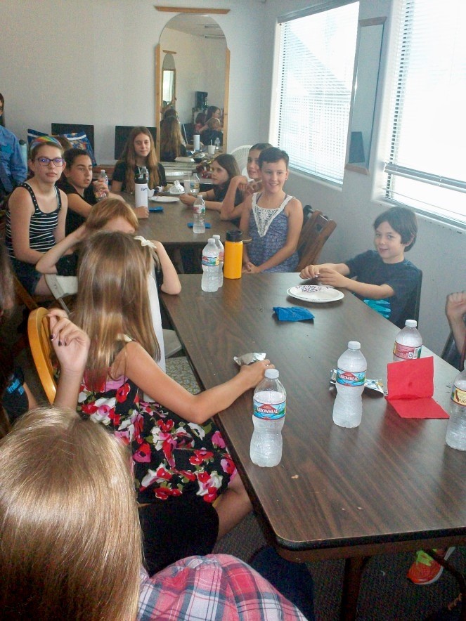 Actors backstage having dinner break together