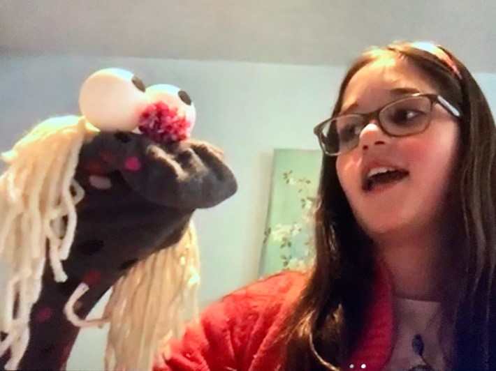 An actor talking to a sock puppet