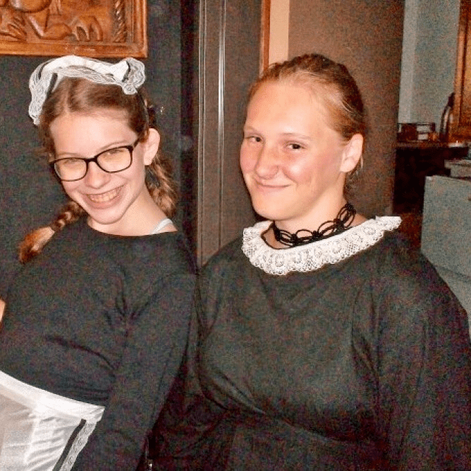 Two actors smiling together for a picture