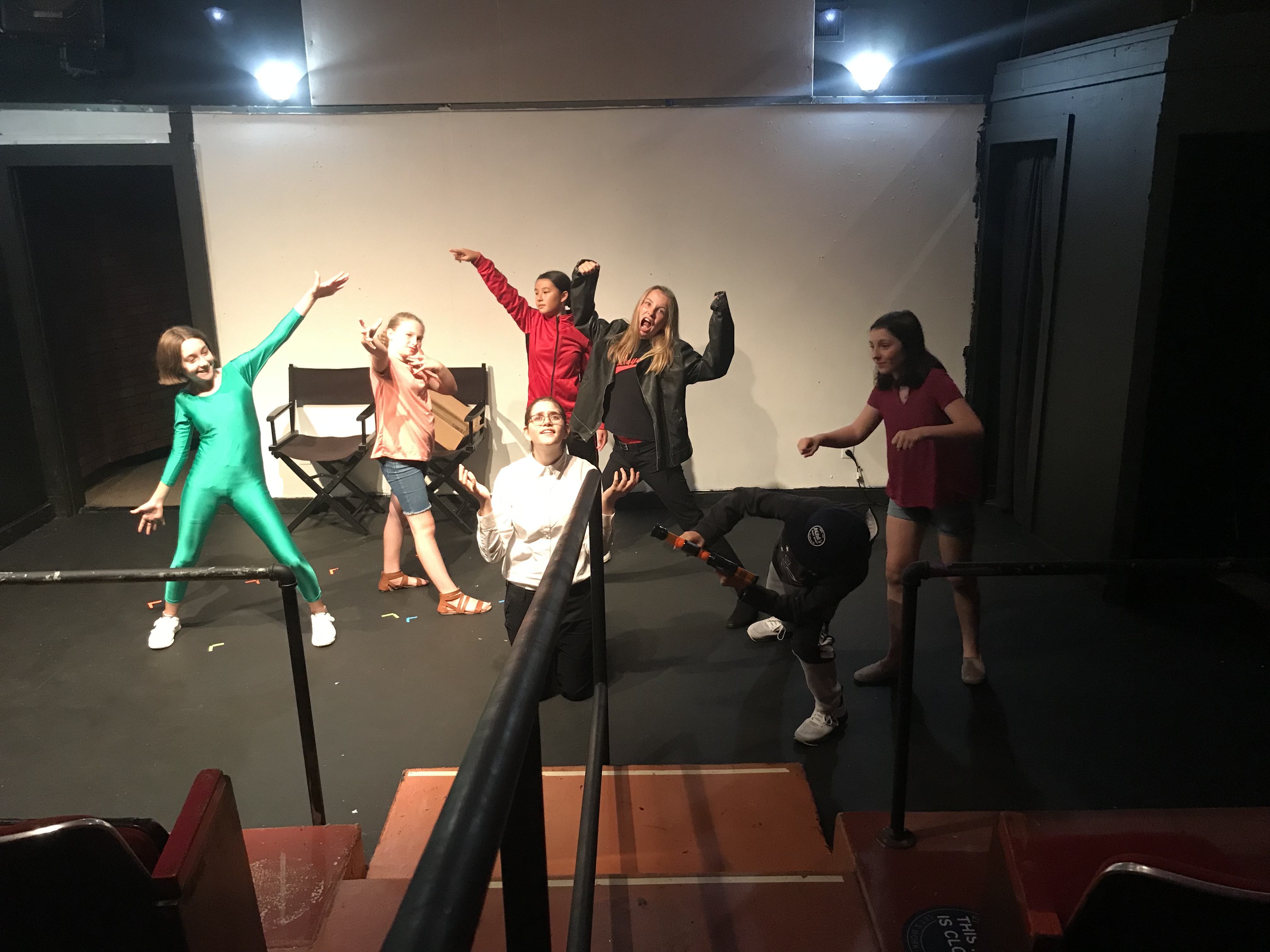 Actors in a crazy pose onstage